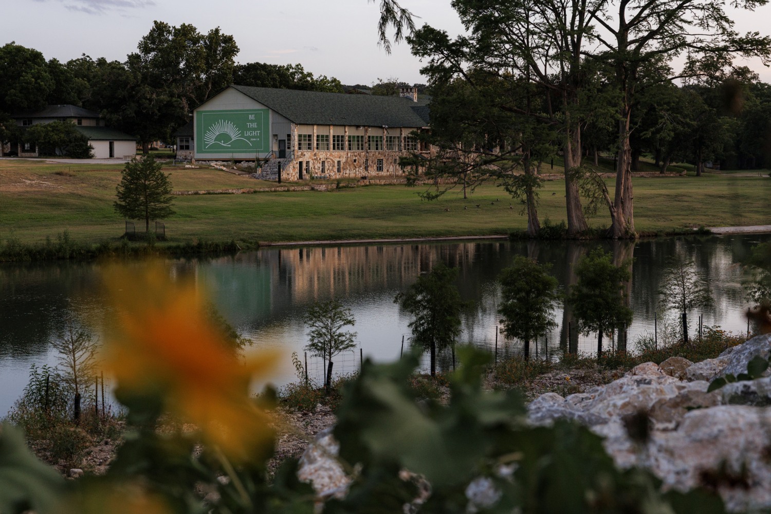 The sun sets over Camp Mystic along the Guadalupe River on Friday, July 3, 2026, in Hunt, Texas.