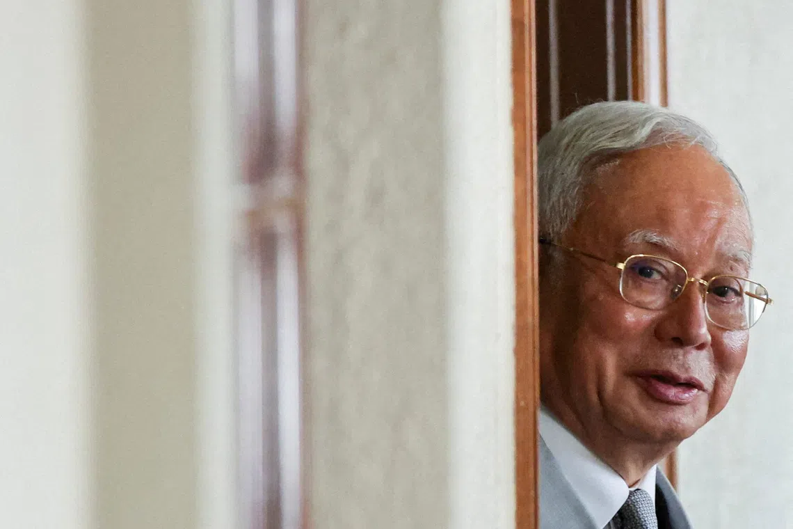 FILE PHOTO: Malaysia's former Prime Minister Najib Razak, jailed for corruption in the multibillion-dollar 1MDB scandal, attends the verdict of his house arrest bid at Kuala Lumpur Courts Complex in Kuala Lumpur, Malaysia December 22, 2025. REUTERS/ Hasnoor Hussain/File Photo