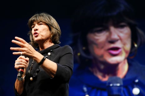 a woman speaks into a microphone