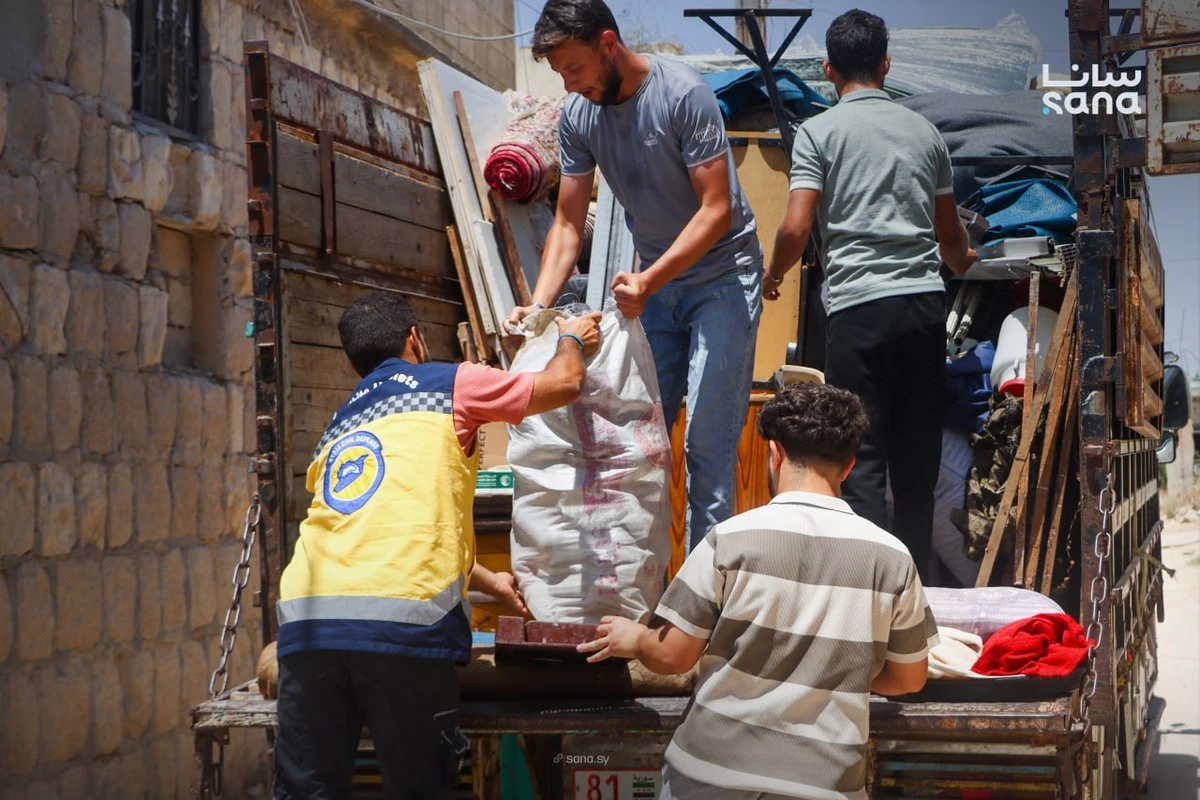 More than 100 displaced Syrian families leave northern camps for homes in Hama