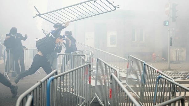 A student drops a barrier as students carry out a blocking protest at the Strasbourg University
