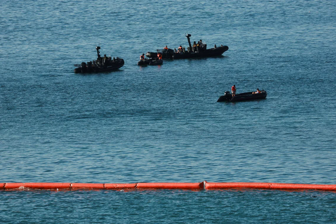 Members of the Royal Moroccan Navy patrol on the Moroccan side of the floating barrier off the border as seen from Ceuta, Spain, on Aug 2, 2026.