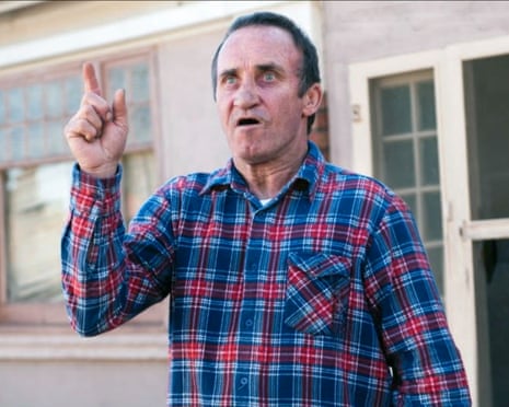 Gary Waddell, wearing a plaid shirt and raising a pointed finger, in the 2012 film The King Is Dead!